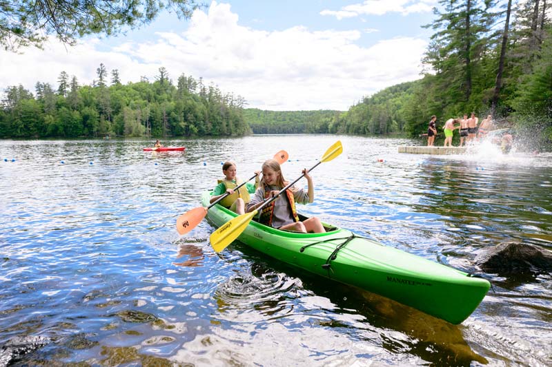 Friends kayaking on Pyramid Lake, Adirondacks